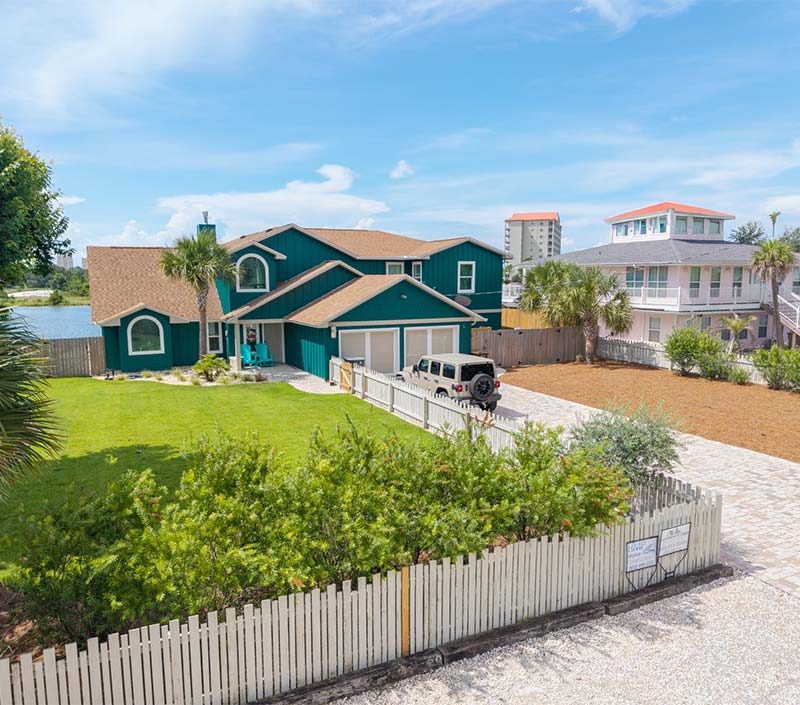 Landscaping and Pavers installed on the driveway of a waterfront home 