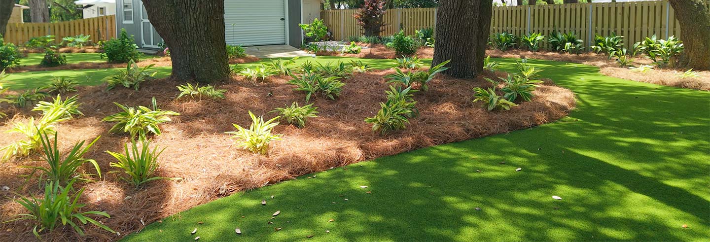 Artificial Grass installed with beds and plants