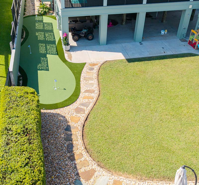Artificial Grass Putting Green on the side of the house