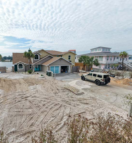 Preparation for coastal landscaping with a paver driveway