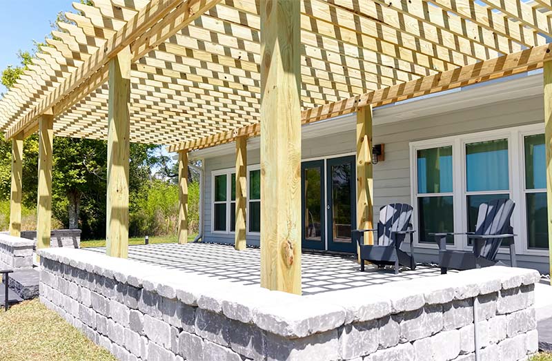 Patio pavers and retaining walls with a beautiful custom pergola