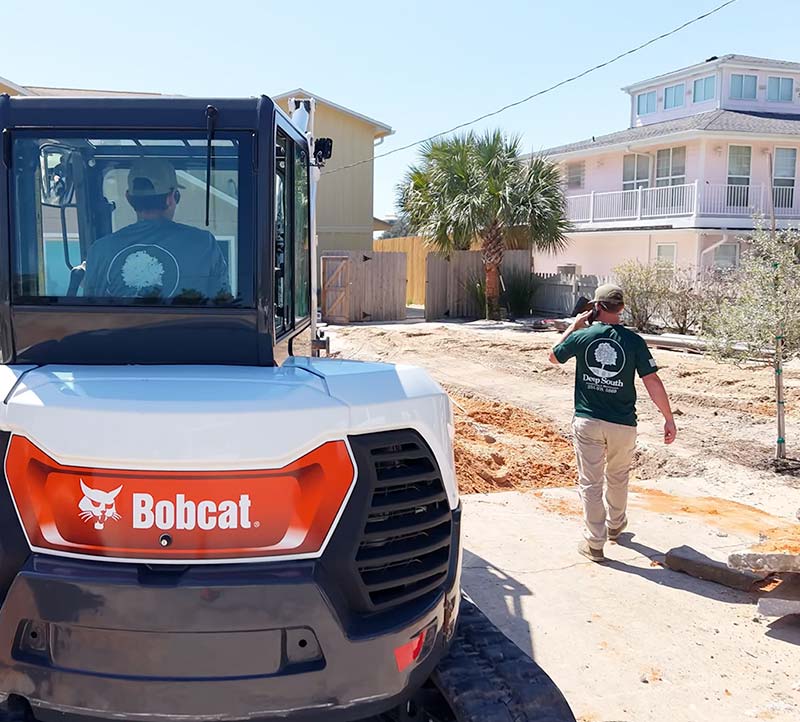 Ground work to create proper drainage for a paver driveway installation