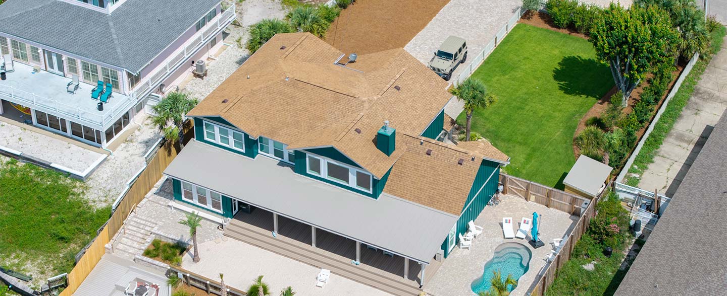 Landscape design Build on a coastal project drone image of Landscape project with patio pavers and front lawn design