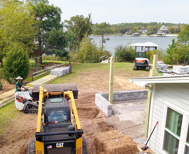 Prep work for drainage on infrastructure before installing a paver patio with pergola